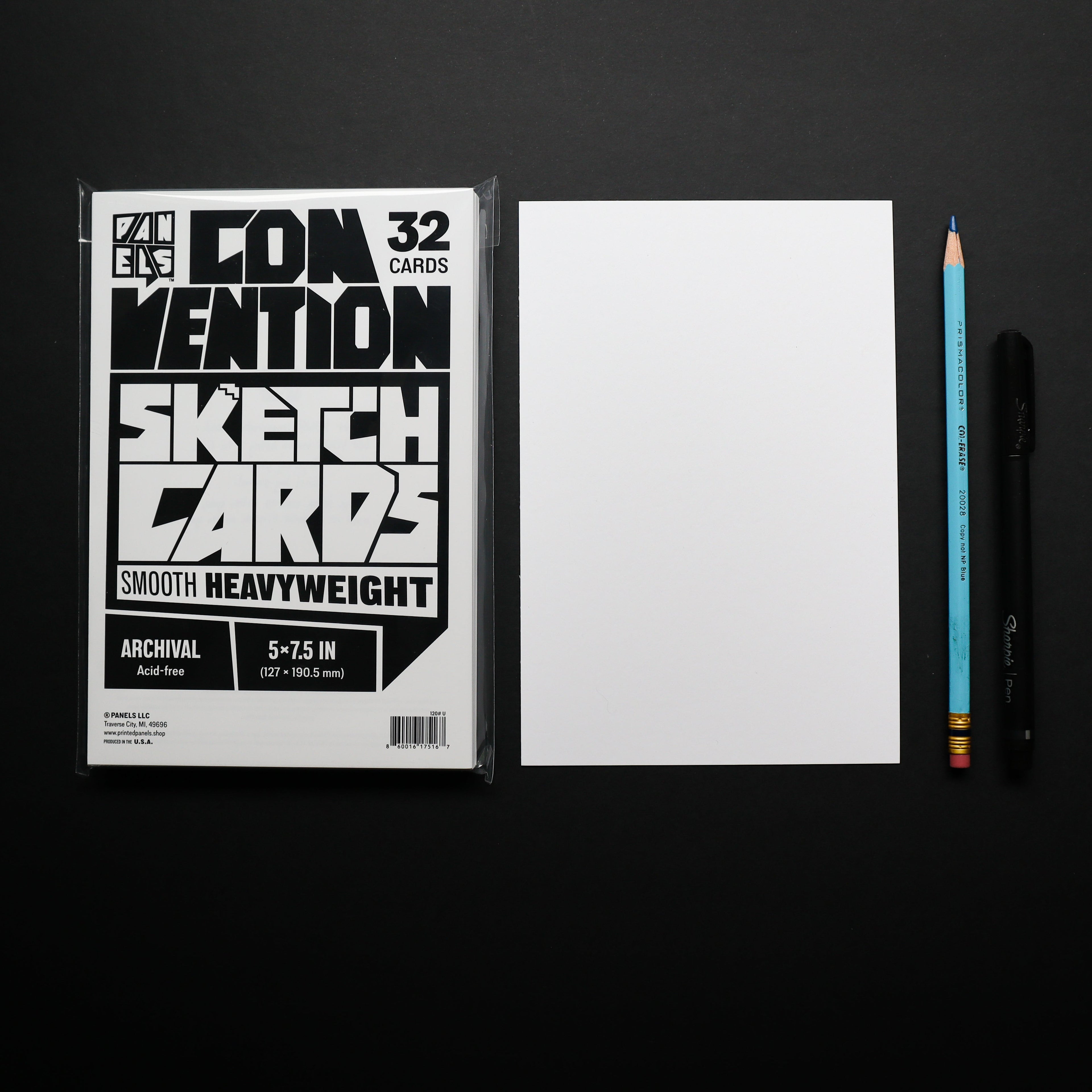 A package of Convection Sketch Cards shown next to a blank white card, a blue pencil, and a black pen on a black background.