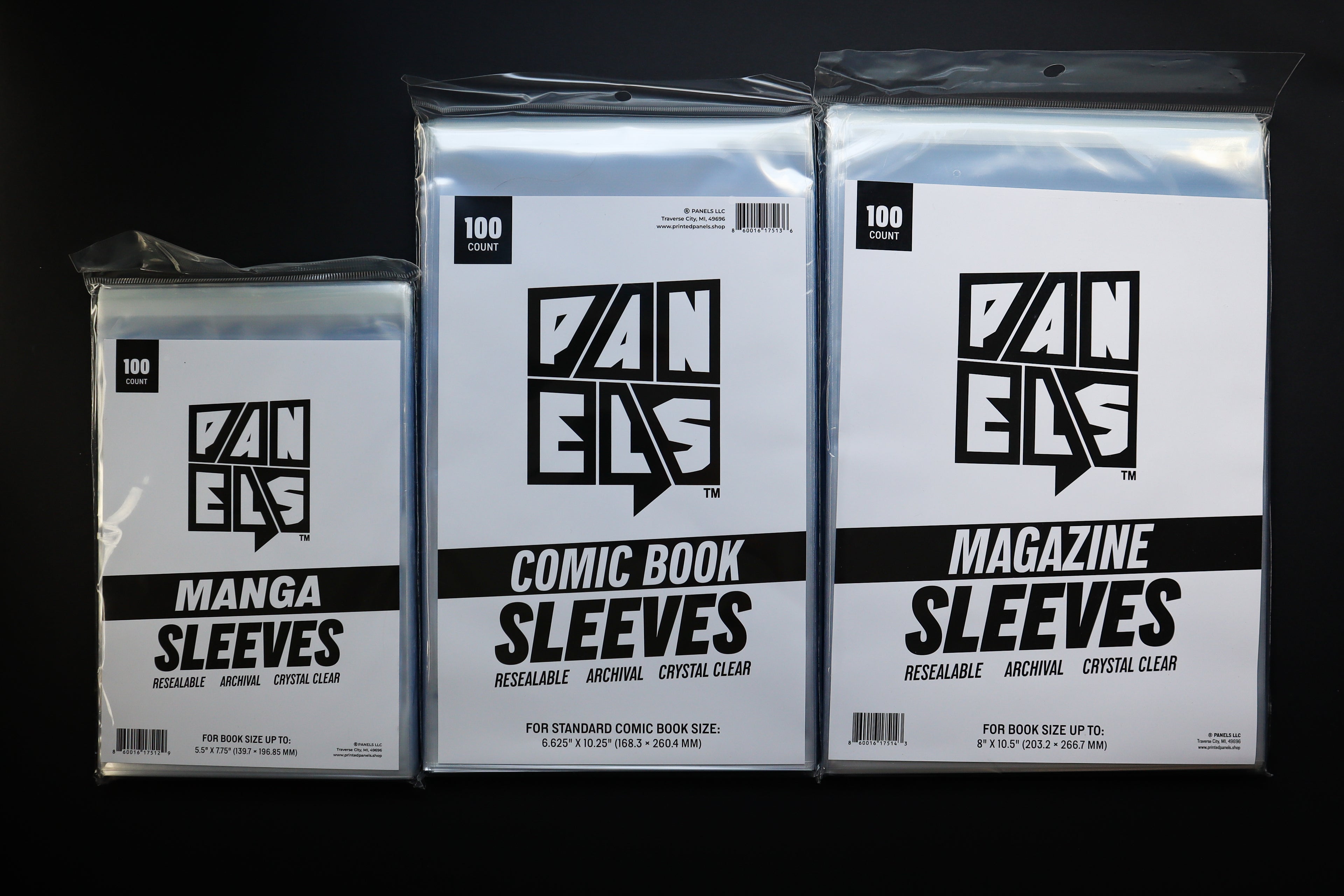 Three shrink-wrapped packages of comic book sleeves in different sizes on a black background: Manga Sleeves, Comic Book Sleeves, and Magazine Sleeves. The sleeves are clear and reusable.